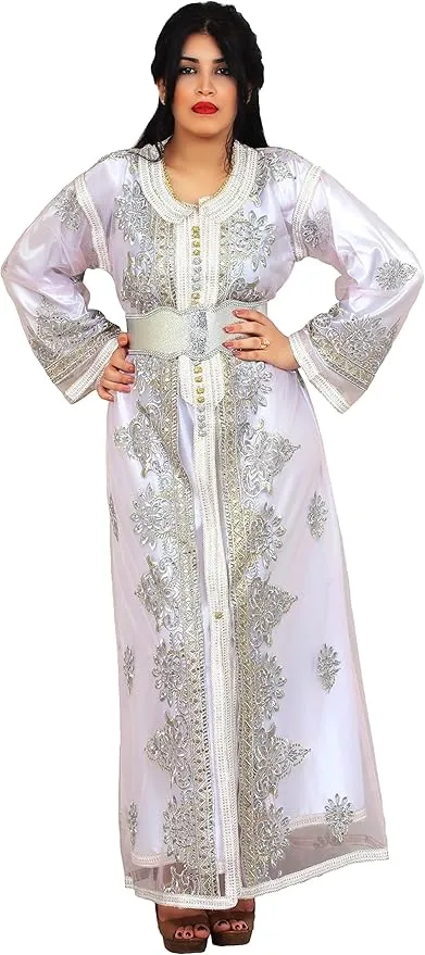 Traditional bridal caftan in white with embroidery and fabric for a bride at a reception.